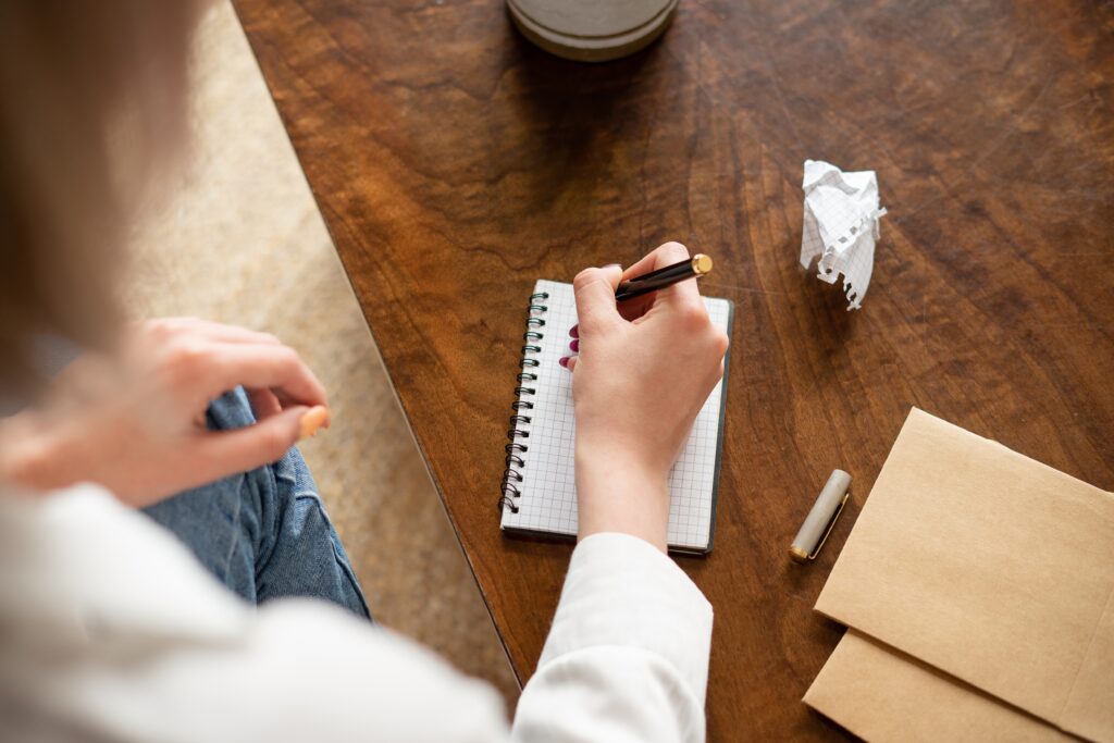woman writing in a notebook